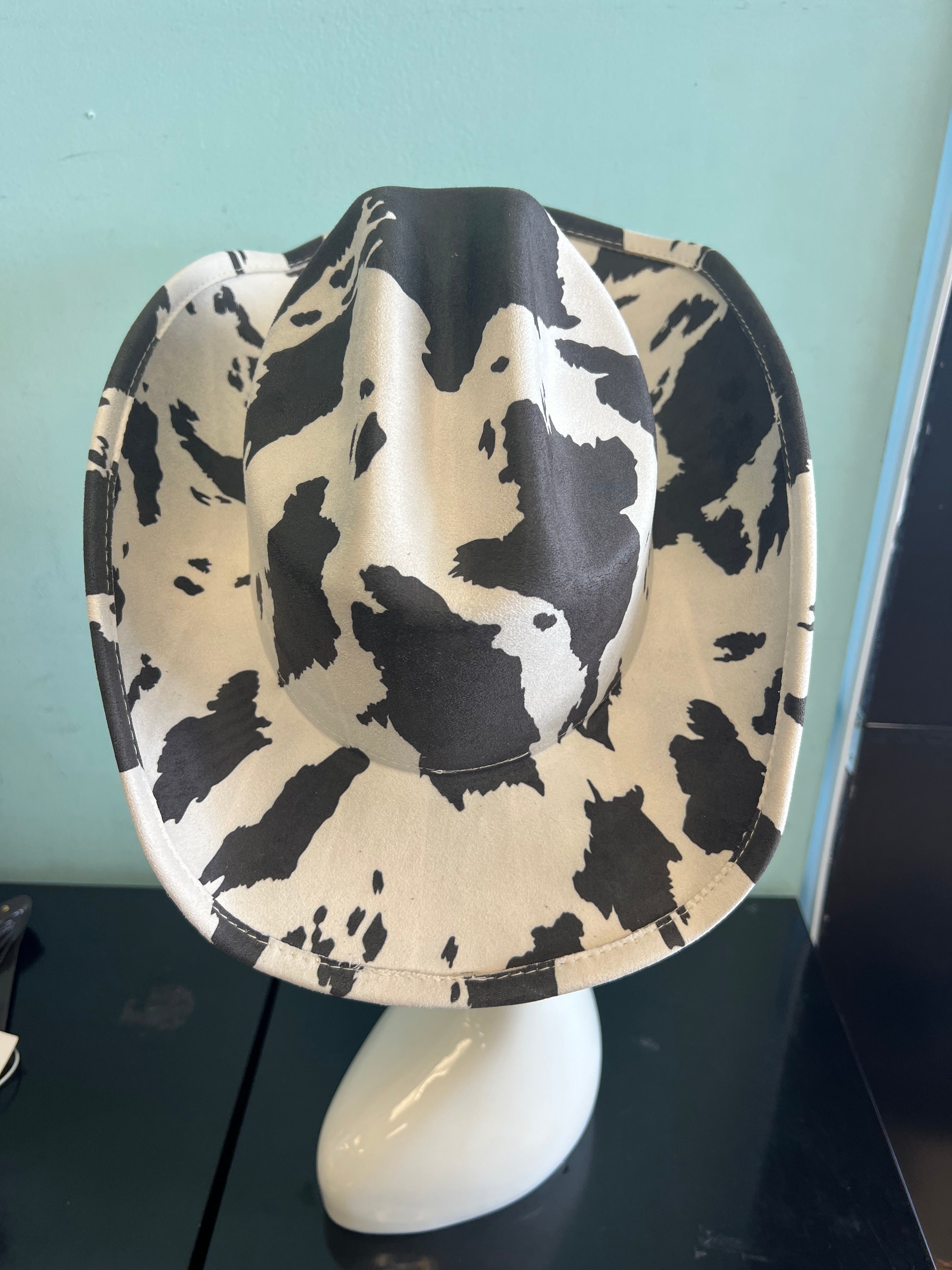 YEEHAW HAT Cow Print
-faux suede cowboy hat in black and ivory cow print
-interior ribbon inside hat to customize size
-stiff, sturdy structure
