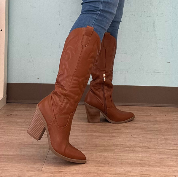 ARIZONA/2025
- Camel Tan Vegan Leather
- Knee High Cowboy Boot
- Western Styling with Stitching Detail
- Inner Half Zipper Closure
- Pointy Toe
- Cone Block Heel, Approx. 3"