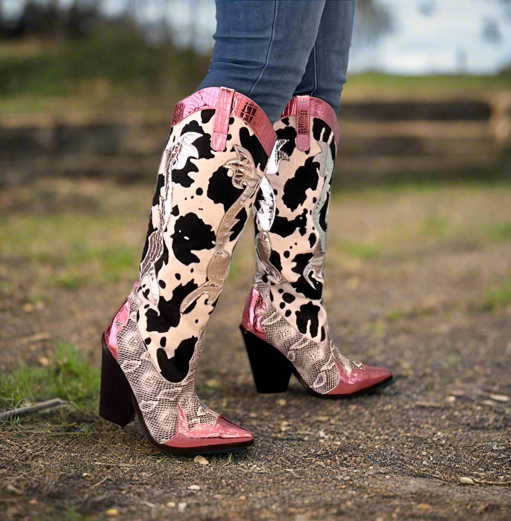 Pink Metallic Black White Multi Faux Cow Snake Zebra Cowboy Boot
- Knee High Colorblock Cowboy Boot
- Pointy Toe
- Cone Stacked Heel, Approx. 3
