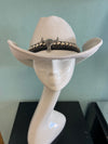 BUCKAROO straw hat natural white
-straw cowboy hat in natural white
-studded, braided, black and white band with silver bull
- moldable wire brim for customizable shape
-interior ribbon inside hat to customize size
This stylish straw cowboy hat in natural white is the perfect addition to your summer wardrobe. Not only is it adorned with a studded, braided black and white band featuring a striking silver bull, but it also boasts a moldable wire brim that allows you to create a unique and customiza