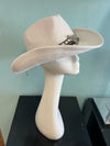 BUCKAROO straw hat natural white
-straw cowboy hat in natural white
-studded, braided, black and white band with silver bull
- moldable wire brim for customizable shape
-interior ribbon inside hat to customize size
This stylish straw cowboy hat in natural white is the perfect addition to your summer wardrobe. Not only is it adorned with a studded, braided black and white band featuring a striking silver bull, but it also boasts a moldable wire brim that allows you to create a unique and customiza