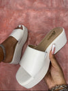 ROOKIE-16
- White Faux Leather
- Slip-On Slide
- Open Toe
- Platform Sole, Approx. 3”