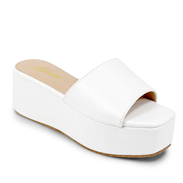 ROOKIE-16
- White Faux Leather
- Slip-On Slide
- Open Toe
- Platform Sole, Approx. 3”