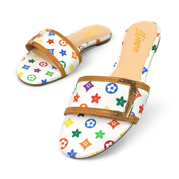 TIZZY-10
- multicolor design on white faux leather
- Flat Sandal
- tan contrast edging on vamp with metal corners
- Open Toe
- Slip-on Slide