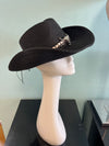 buckaroo straw black cowboy hat
-straw cowboy hat in black
-studded, braided, black and white band with silver bull
- moldable wire brim for customizable shape
-interior ribbon inside hat to customize size