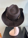 buckaroo straw black cowboy hat
-straw cowboy hat in black
-studded, braided, black and white band with silver bull
- moldable wire brim for customizable shape
-interior ribbon inside hat to customize size
