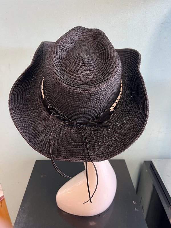 buckaroo straw black cowboy hat
-straw cowboy hat in black
-studded, braided, black and white band with silver bull
- moldable wire brim for customizable shape
-interior ribbon inside hat to customize size