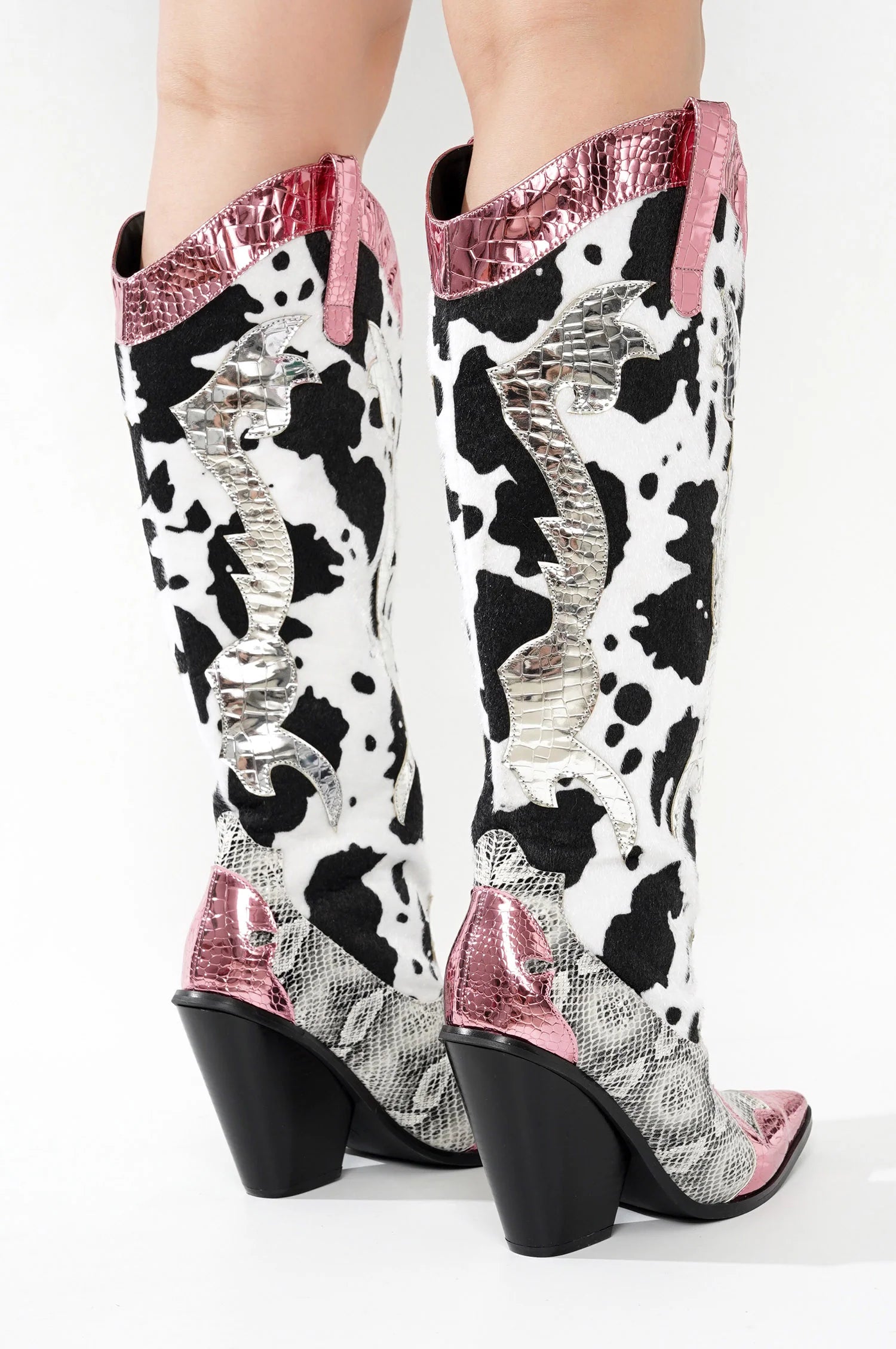 Pink Metallic Black White Multi Faux Cow Snake Zebra Cowboy Boot
- Knee High Colorblock Cowboy Boot
- Pointy Toe
- Cone Stacked Heel, Approx. 3