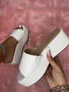 ROOKIE-16
- White Faux Leather
- Slip-On Slide
- Open Toe
- Platform Sole, Approx. 3”