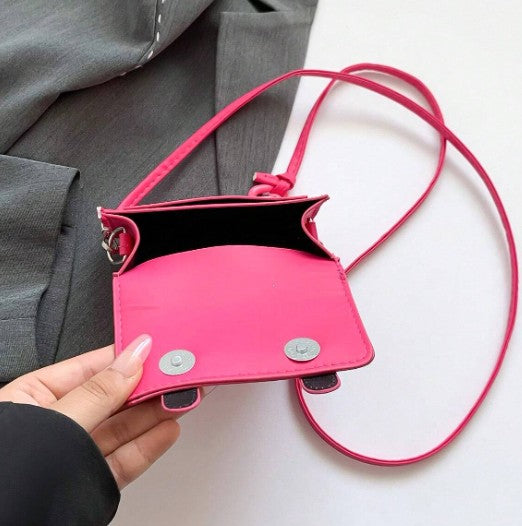 TRINA HOT PINK MINI BAG WITH DOUBLE BUCKLE DESIGN AND CROSS BODY STRAP