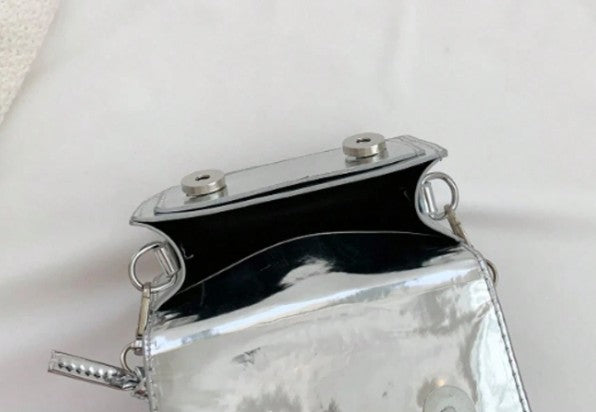 TRINA SILVER MINI BAG WITH DOUBLE BUCKLE DESIGN AND CROSS BODY STRAP
