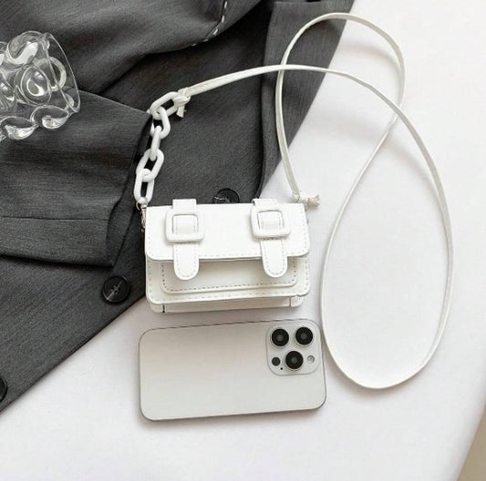 TRINA WHITE MINI BAG WITH DOUBLE BUCKLE DESIGN AND CROSS BODY STRAP