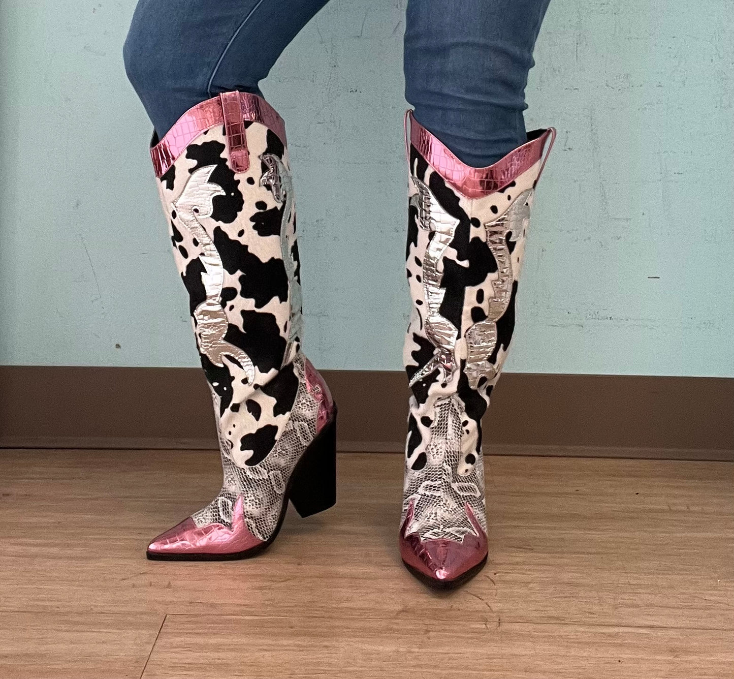 Pink Metallic Black White Multi Faux Cow Snake Zebra Cowboy Boot
- Knee High Colorblock Cowboy Boot
- Pointy Toe
- Cone Stacked Heel, Approx. 3"