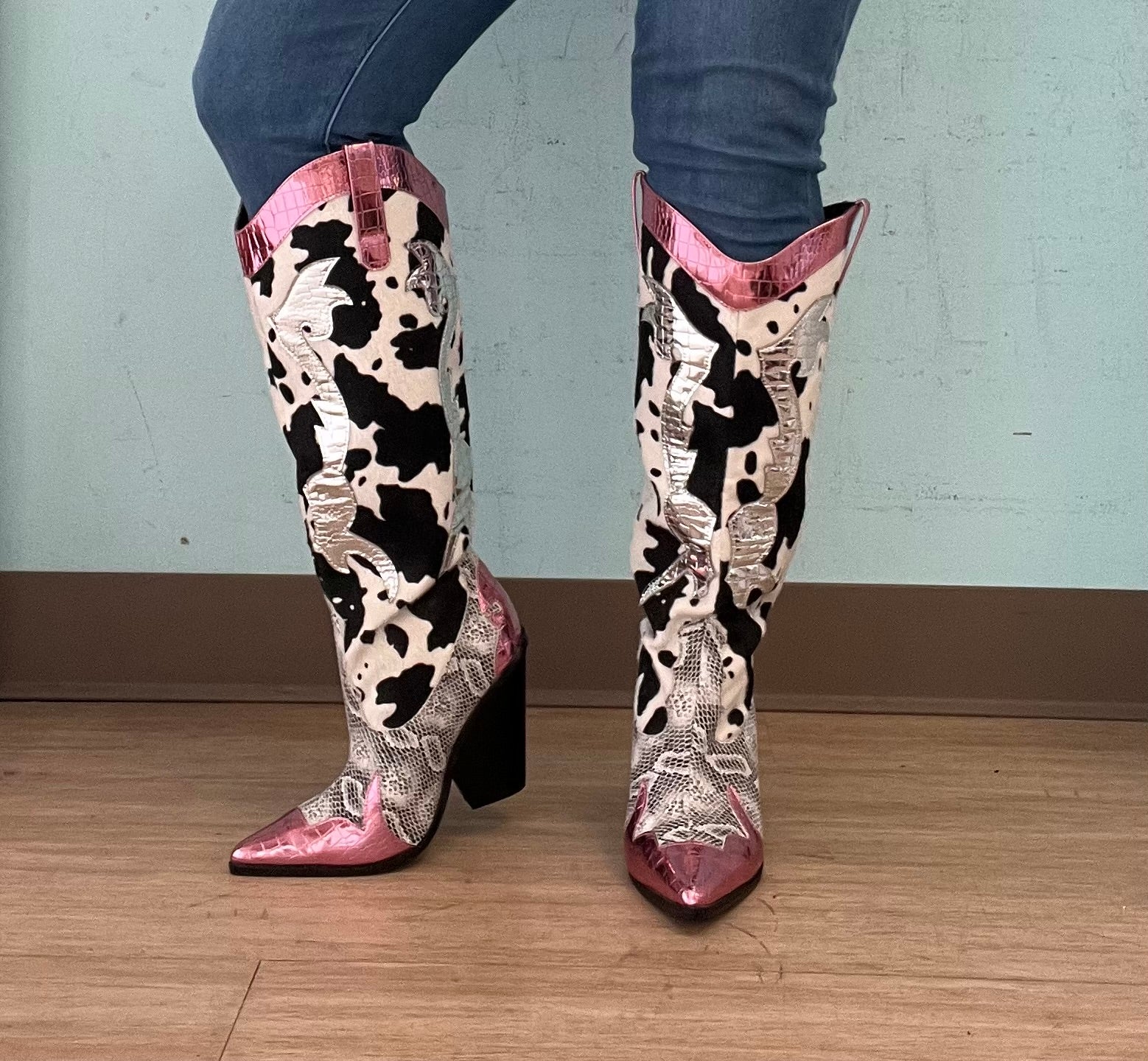 Pink Metallic Black White Multi Faux Cow Snake Zebra Cowboy Boot
- Knee High Colorblock Cowboy Boot
- Pointy Toe
- Cone Stacked Heel, Approx. 3"