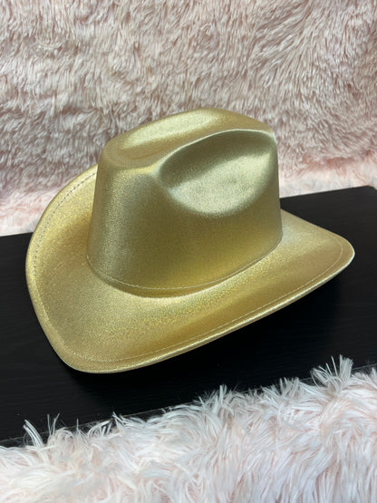 -cowboy hat in shiny gold

-glittery poly fabric

-interior ribbon inside hat to customize size

-stiff, sturdy structure