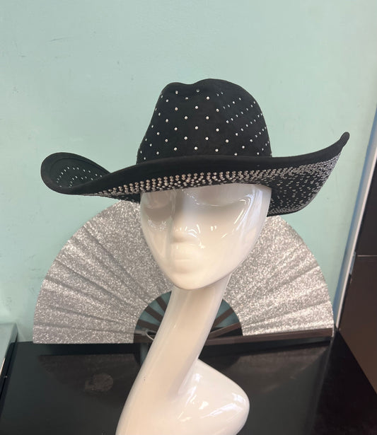 DIVA RHINESTONE COWBOY HAT black

-rhinestone encrusted faux suede cowboy hat

-rhinestones on top and bottom brim&nbsp;

-interior ribbon inside hat to customize size

-stiff, sturdy structure