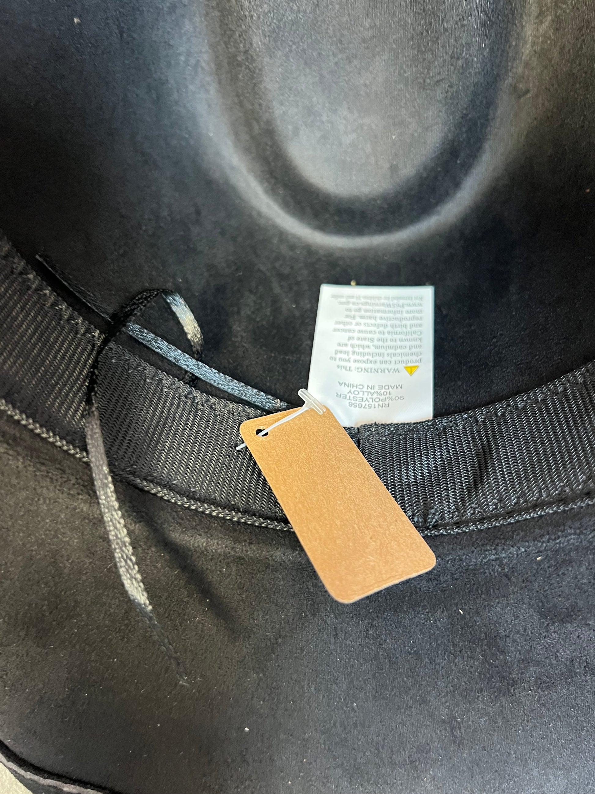 -faux suede cowboy hat in black

-brown faux leather band with silver studs and bull detail

-interior ribbon inside hat to customize size

-stiff, sturdy structure