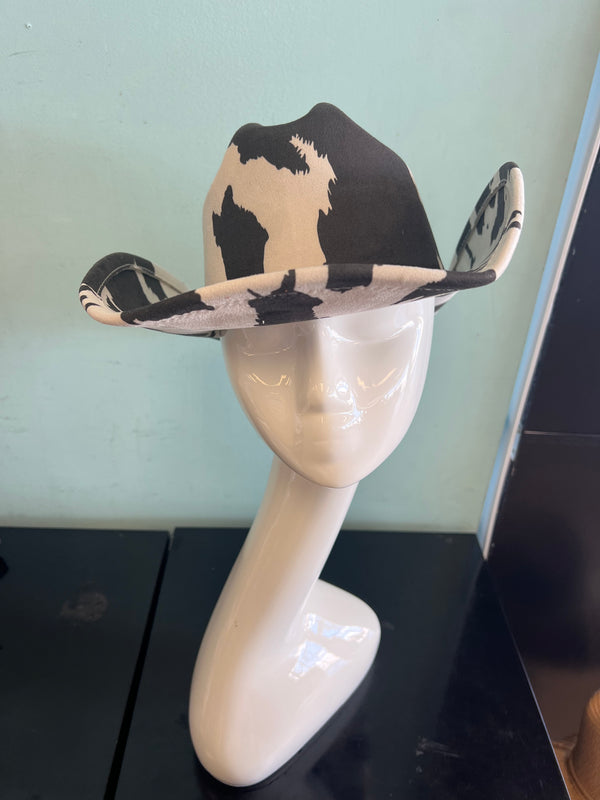 YEEHAW HAT Cow Print

-faux suede cowboy hat in black and ivory cow print

-interior ribbon inside hat to customize size

-stiff, sturdy structure