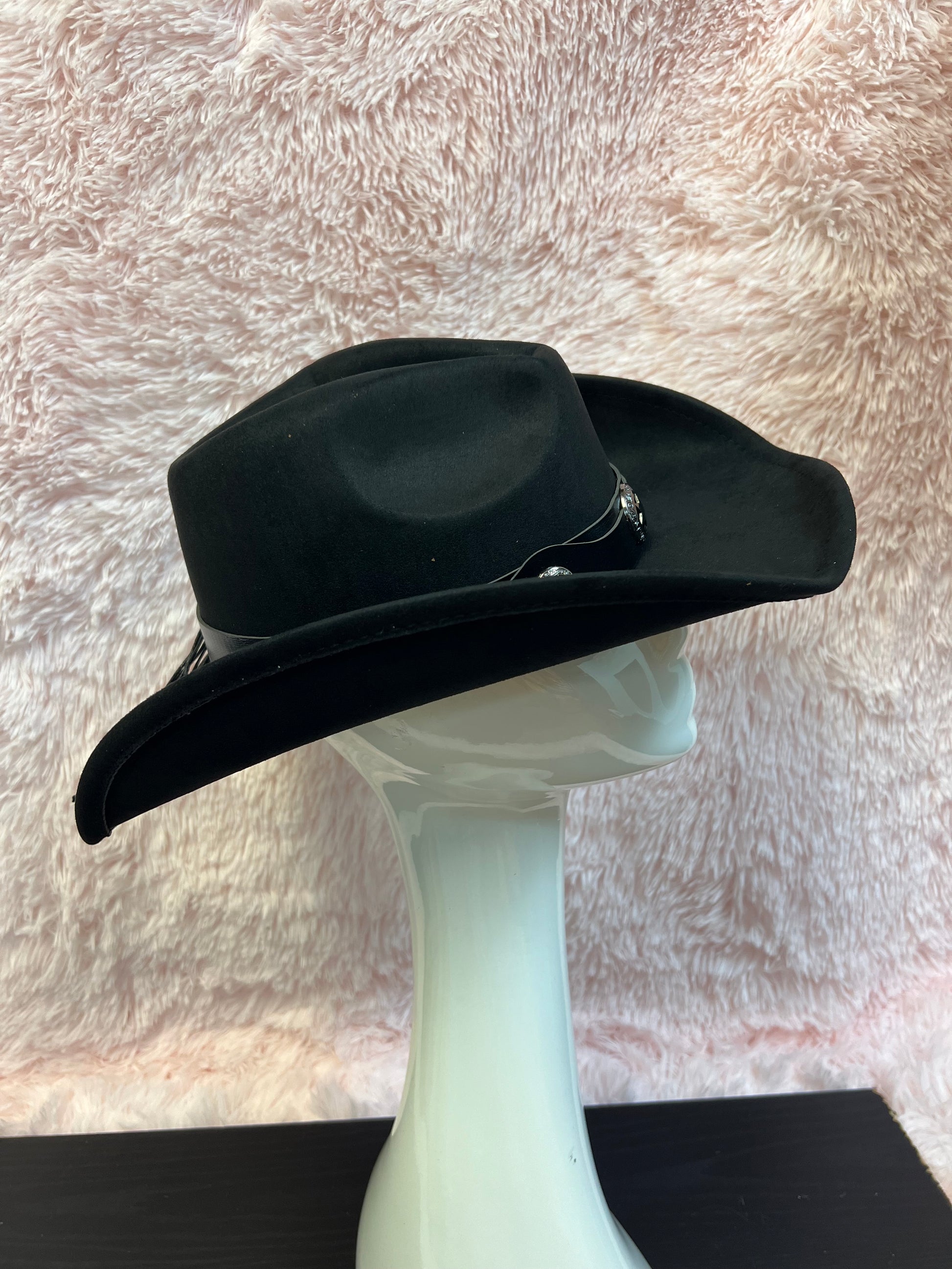 -faux suede cowboy hat in black

-black faux leather band with gunmetal stars detail

-interior ribbon inside hat to customize size

-stiff, sturdy structure