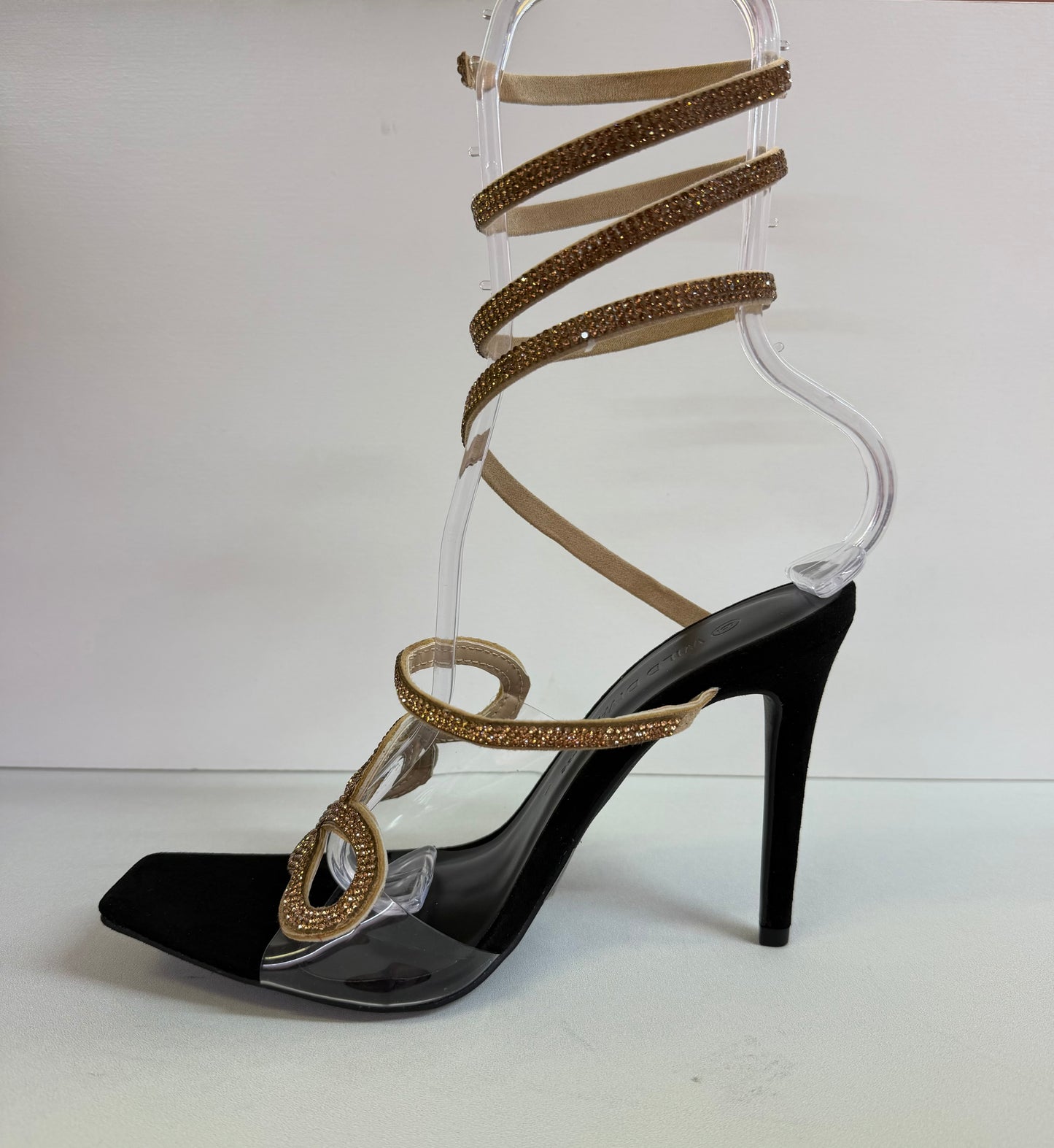 LACEY-35 BLACK STILETTO HEEL WITH GOLD RHINESTONE ASSYMETRICAL SERPENT DESIGN ON CLEAR VAMP AND SPIRAL ANKLE STRAP