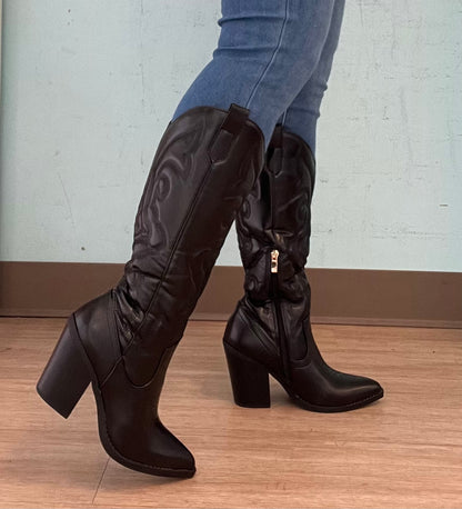 ARIZONA/2025

- Black Vegan Leather
- Knee High Cowboy Boot
- Western Styling with Stitching Detail
- Inner Half Zipper Closure
- Pointy Toe
- Cone Block Heel, Approx. 3"