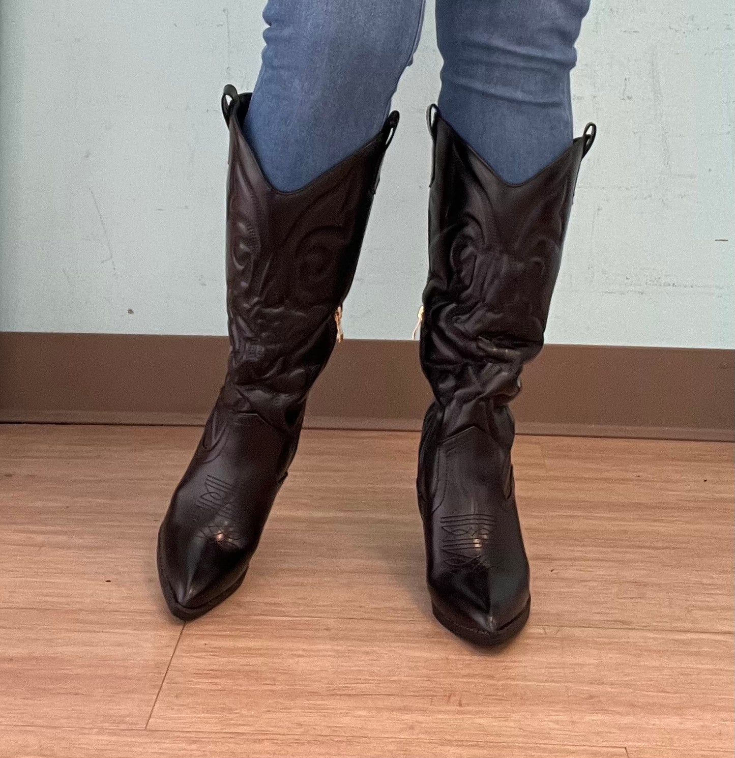 ARIZONA/2025

- Black Vegan Leather
- Knee High Cowboy Boot
- Western Styling with Stitching Detail
- Inner Half Zipper Closure
- Pointy Toe
- Cone Block Heel, Approx. 3"