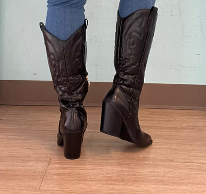ARIZONA/2025

- Black Vegan Leather
- Knee High Cowboy Boot
- Western Styling with Stitching Detail
- Inner Half Zipper Closure
- Pointy Toe
- Cone Block Heel, Approx. 3"