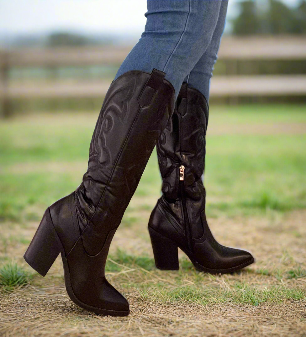 ARIZONA/2025

- Black Vegan Leather
- Knee High Cowboy Boot
- Western Styling with Stitching Detail
- Inner Half Zipper Closure
- Pointy Toe
- Cone Block Heel, Approx. 3"