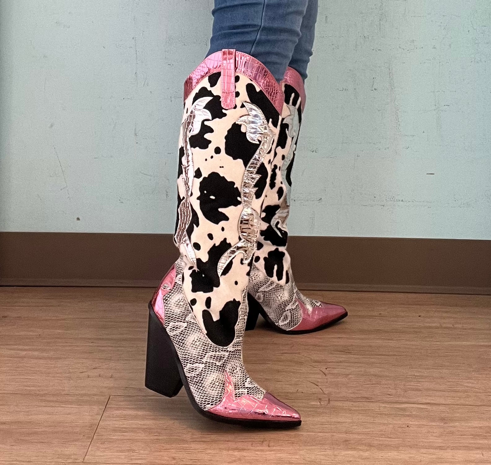 Pink Metallic Black White Multi Faux Cow Snake Zebra Cowboy Boot
- Knee High Colorblock Cowboy Boot
- Pointy Toe
- Cone Stacked Heel, Approx. 3"