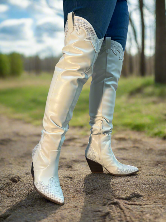 EVERYWHERE-3 white

- White Faux Leather Cowboy Boot
- Rhinestone Detail
- Pointy Toe Thigh High
- Cone Stacked Heel, Approx. 3.5"