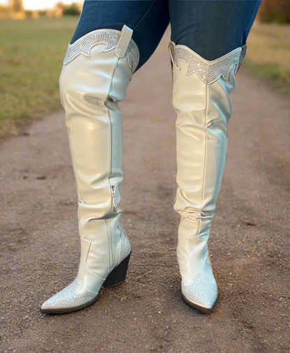 EVERYWHERE-3 white

- White Faux Leather Cowboy Boot
- Rhinestone Detail
- Pointy Toe Thigh High
- Cone Stacked Heel, Approx. 3.5"