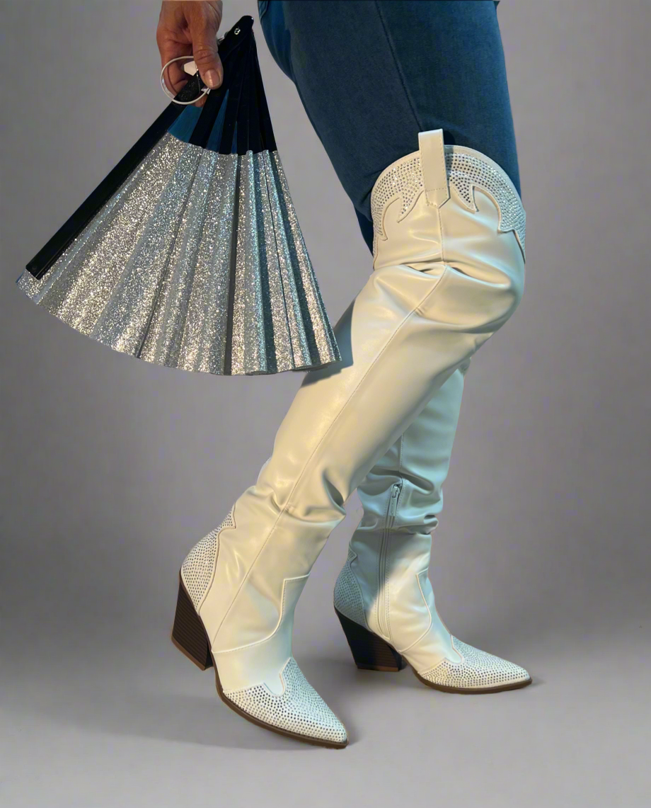 EVERYWHERE-3 white

- White Faux Leather Cowboy Boot
- Rhinestone Detail
- Pointy Toe Thigh High
- Cone Stacked Heel, Approx. 3.5"