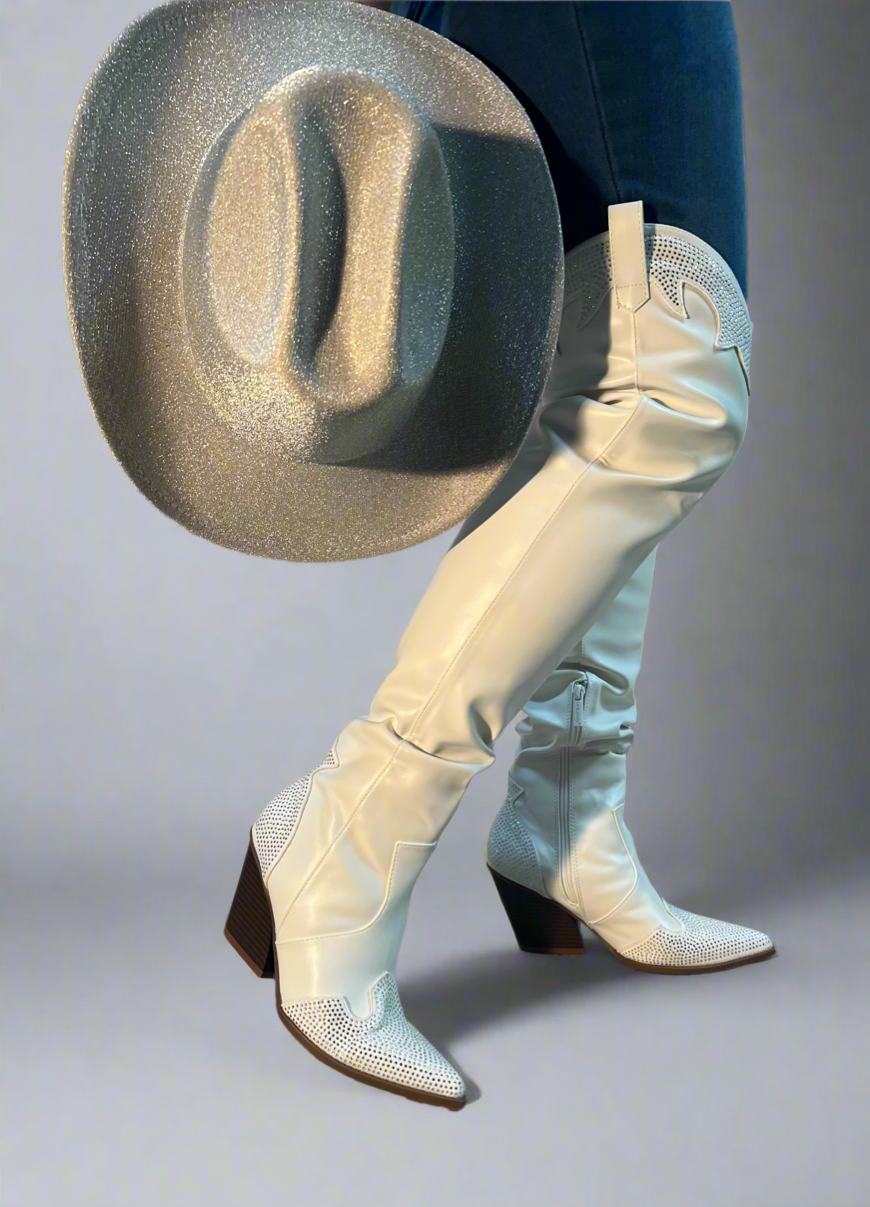 EVERYWHERE-3 white

- White Faux Leather Cowboy Boot
- Rhinestone Detail
- Pointy Toe Thigh High
- Cone Stacked Heel, Approx. 3.5"