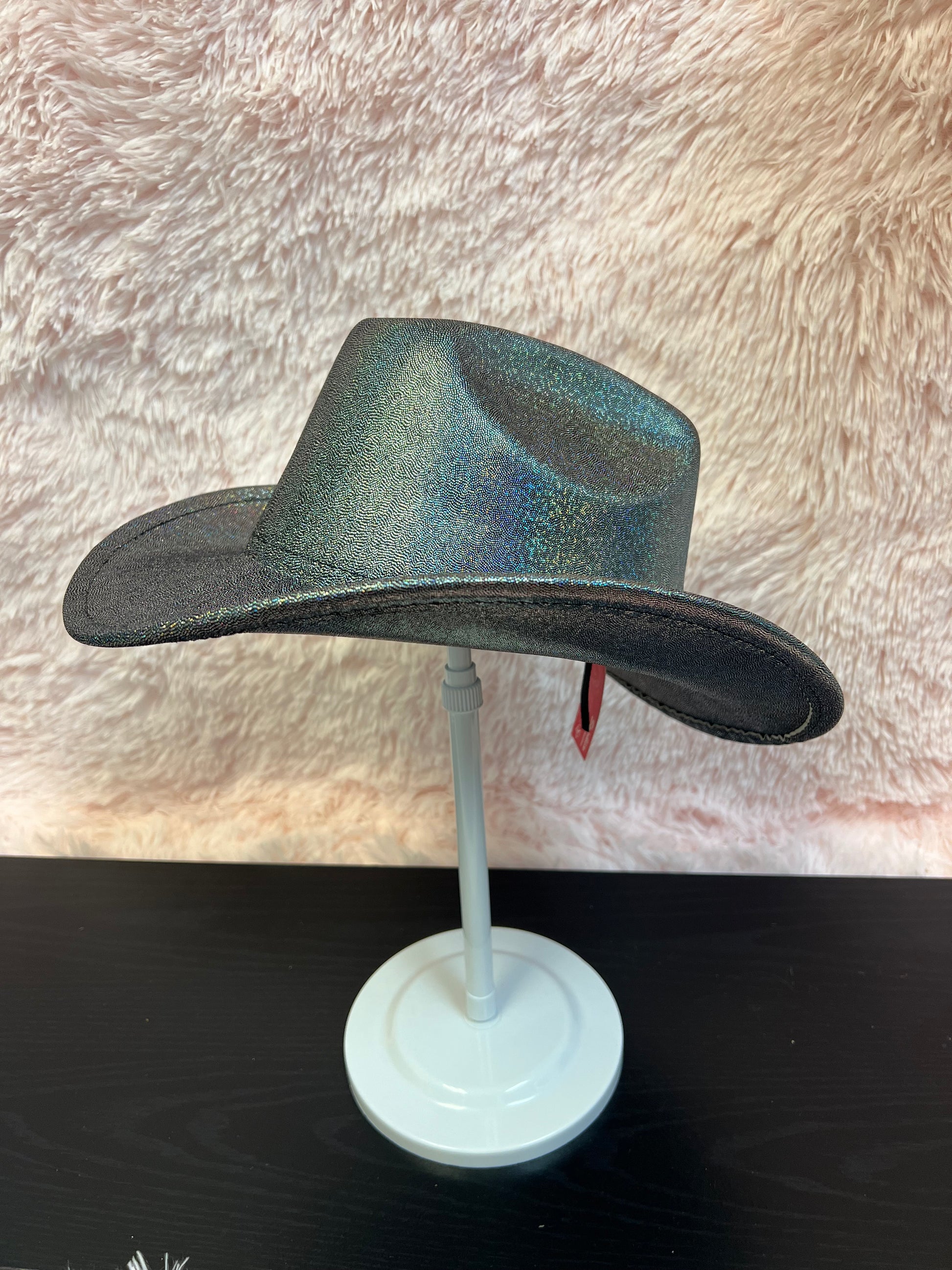 -cowboy hat with black base and iridescent glitter&nbsp;

-glittery poly fabric&nbsp;

-interior ribbon inside hat to customize size

-stiff, sturdy structure