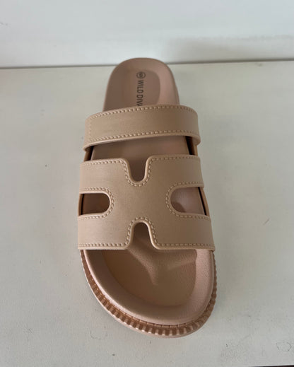 GINO-24

- Nude Tan Sandal
- Open Toe
- Cutout Vamp Detail
- Slip-On Slide
- Flatform Sole, Approx. 1"
- Whole Sizes Only