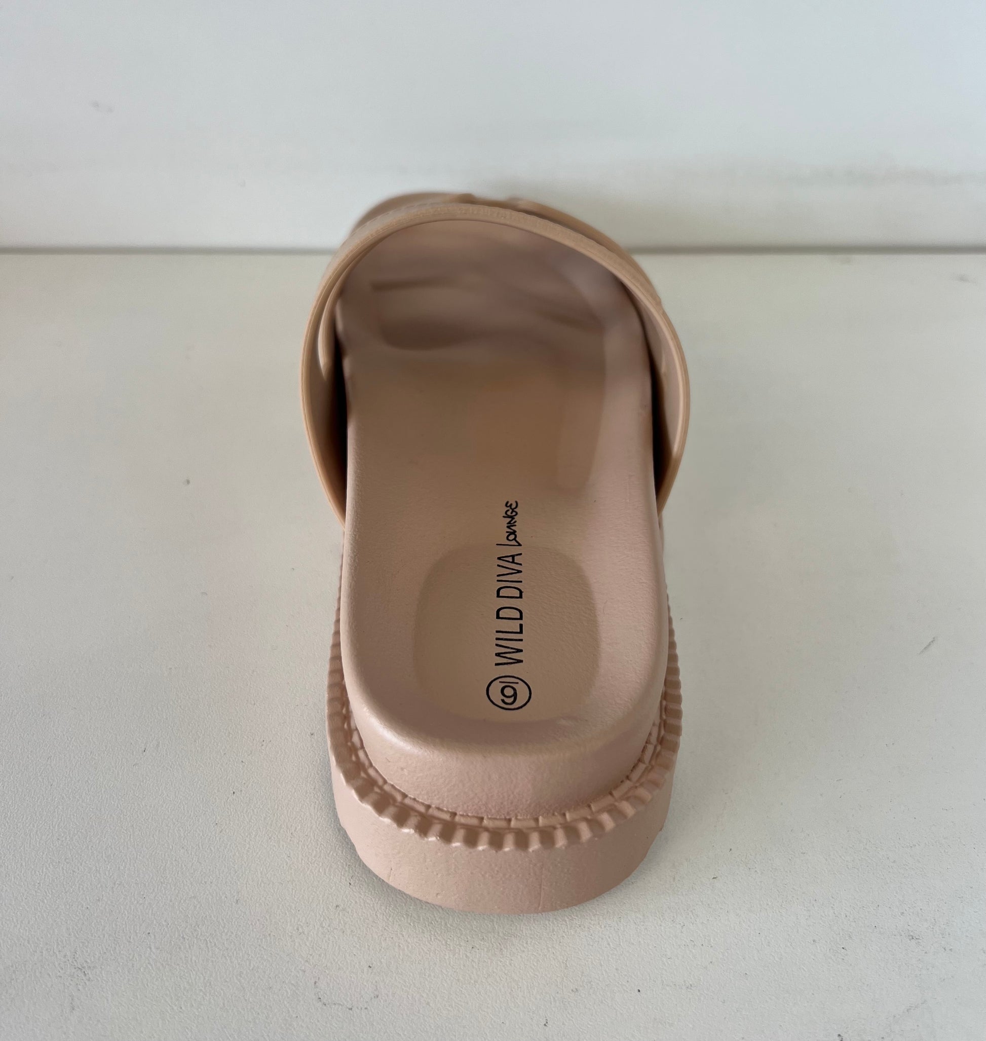 GINO-24

- Nude Tan Sandal
- Open Toe
- Cutout Vamp Detail
- Slip-On Slide
- Flatform Sole, Approx. 1"
- Whole Sizes Only