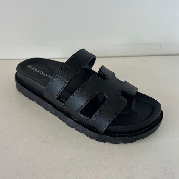 GINO-24 Black

- Black Sandal
- Open Toe
- Cutout Vamp Detail
- Slip-On Slide
- Flatform Sole, Approx. 1"
- Whole Sizes Only