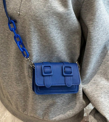 TRINA BLUE MINI BAG WITH DOUBLE BUCKLE DESIGN AND CROSS BODY STRAP