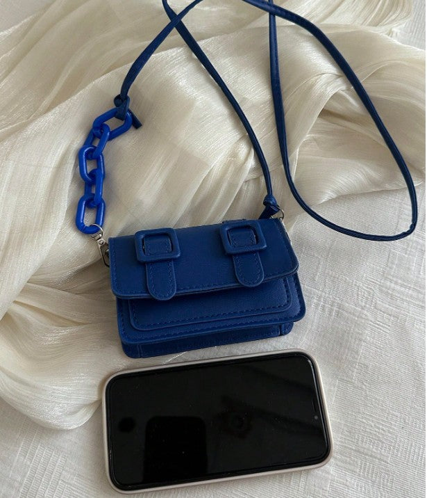 TRINA BLUE MINI BAG WITH DOUBLE BUCKLE DESIGN AND CROSS BODY STRAP