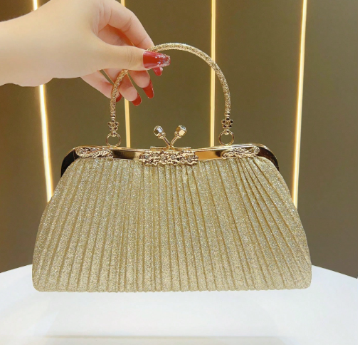 ALEXSIS GOLD HARD CASE CLUTCH WITH PLEATED SHIMMERY GLIITERY FABRIC WITH GOLD TWIST CLOSURE AND HANDLE