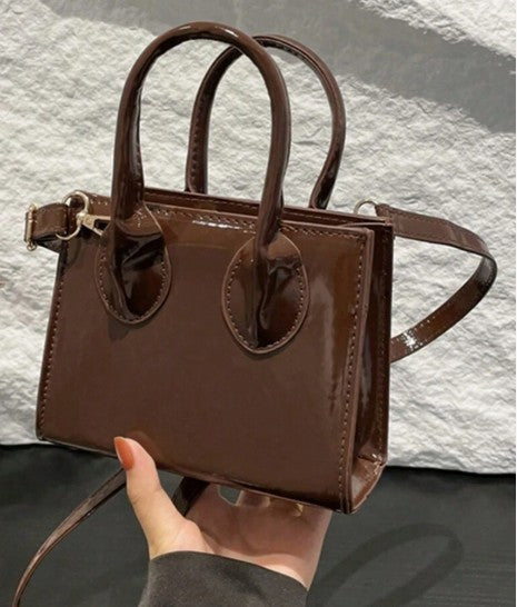 JOELLE BROWN PATENT SQUARE PURSE