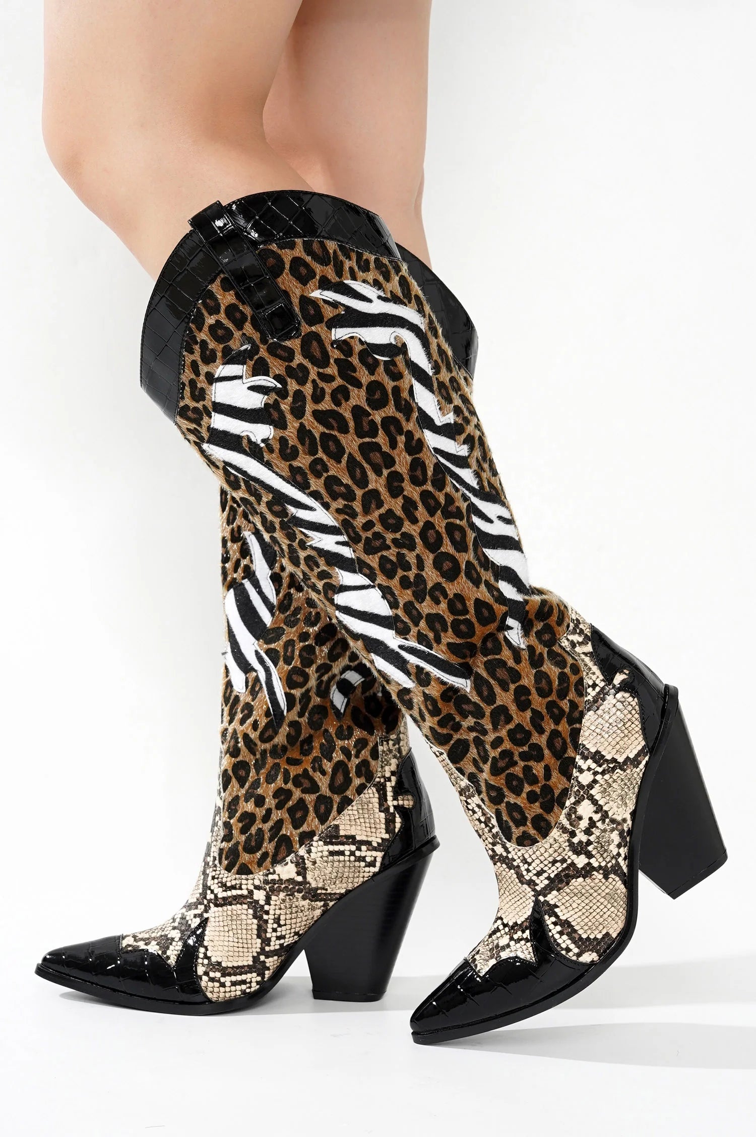 Black Brown Multi Faux Leopard Snake Zebra Cowboy Boot
- Knee High Colorblock Cowboy Boot
- Pointy Toe
- Cone Stacked Heel, Approx. 3"