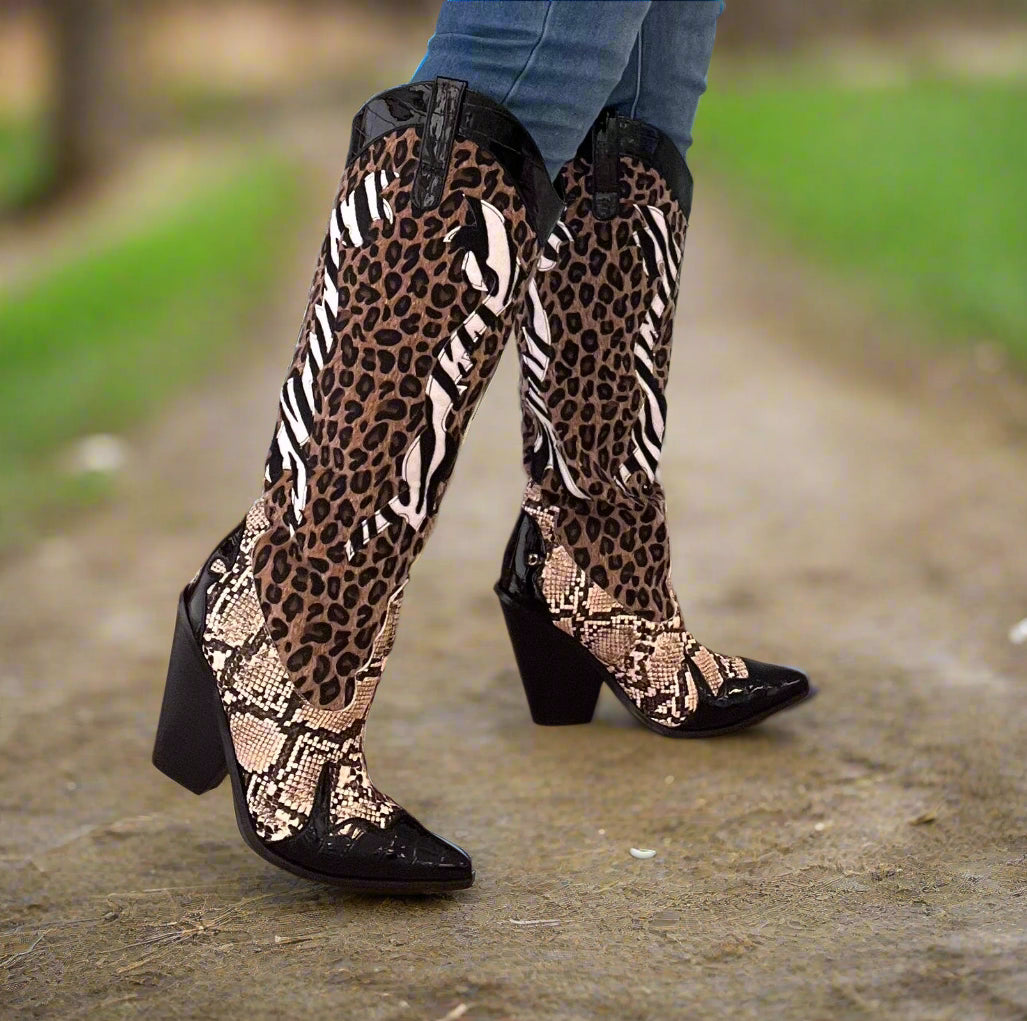 Karine Black Brown Multi Faux Leopard Snake Zebra Cowboy Boot
- Knee High Colorblock Cowboy Boot
- Pointy Toe
- Cone Stacked Heel, Approx. 3"