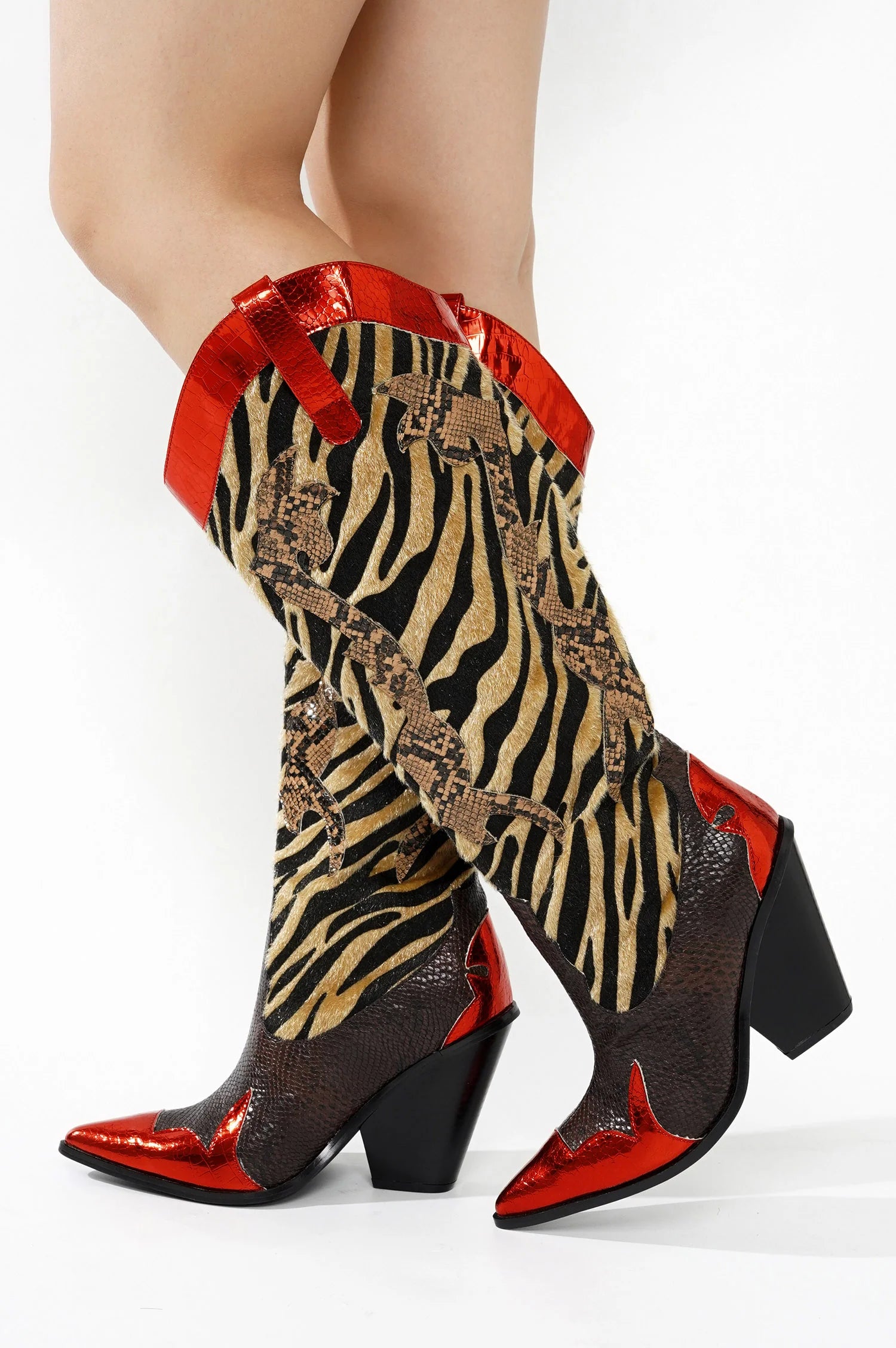Red Metallic Black Brown Multi Faux Tiger Snake Cowboy Boot
- Knee High Colorblock Cowboy Boot
- Pointy Toe
- Cone Stacked Heel, Approx. 3"