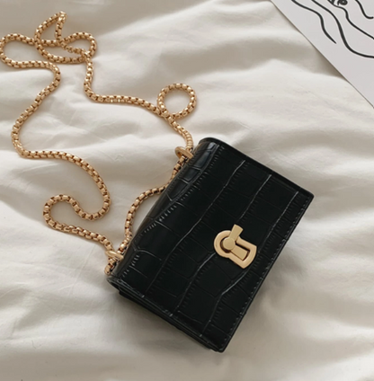 LIZETTE BLACK FAUX CROC MINI BAG WITH GOLD TURN LOCK AND GOLD CHAIN CROSS BODY STRAP
