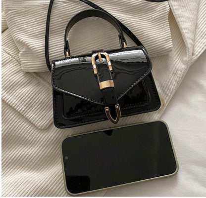 MORGAN BLACK PATENT LEATHER CROSS BODY BAG WITH GOLD BUCKLE DETAIL