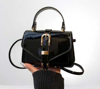 MORGAN BLACK PATENT LEATHER CROSS BODY BAG WITH GOLD BUCKLE DETAIL