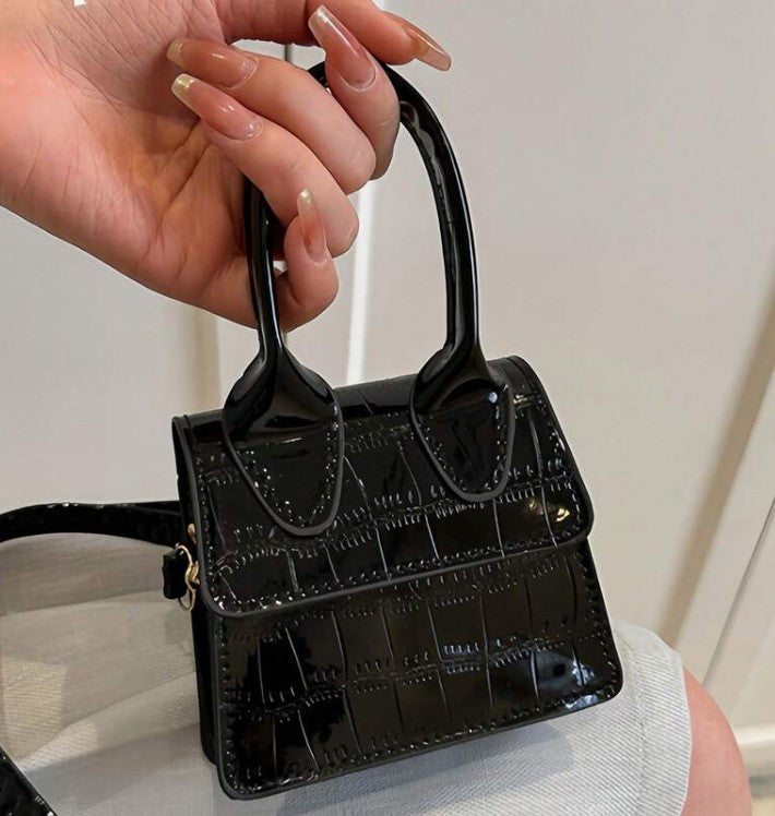 NEDRA BLACK PATENT EMBOSSED MINI BAG WITH CROSS BODY STRAP