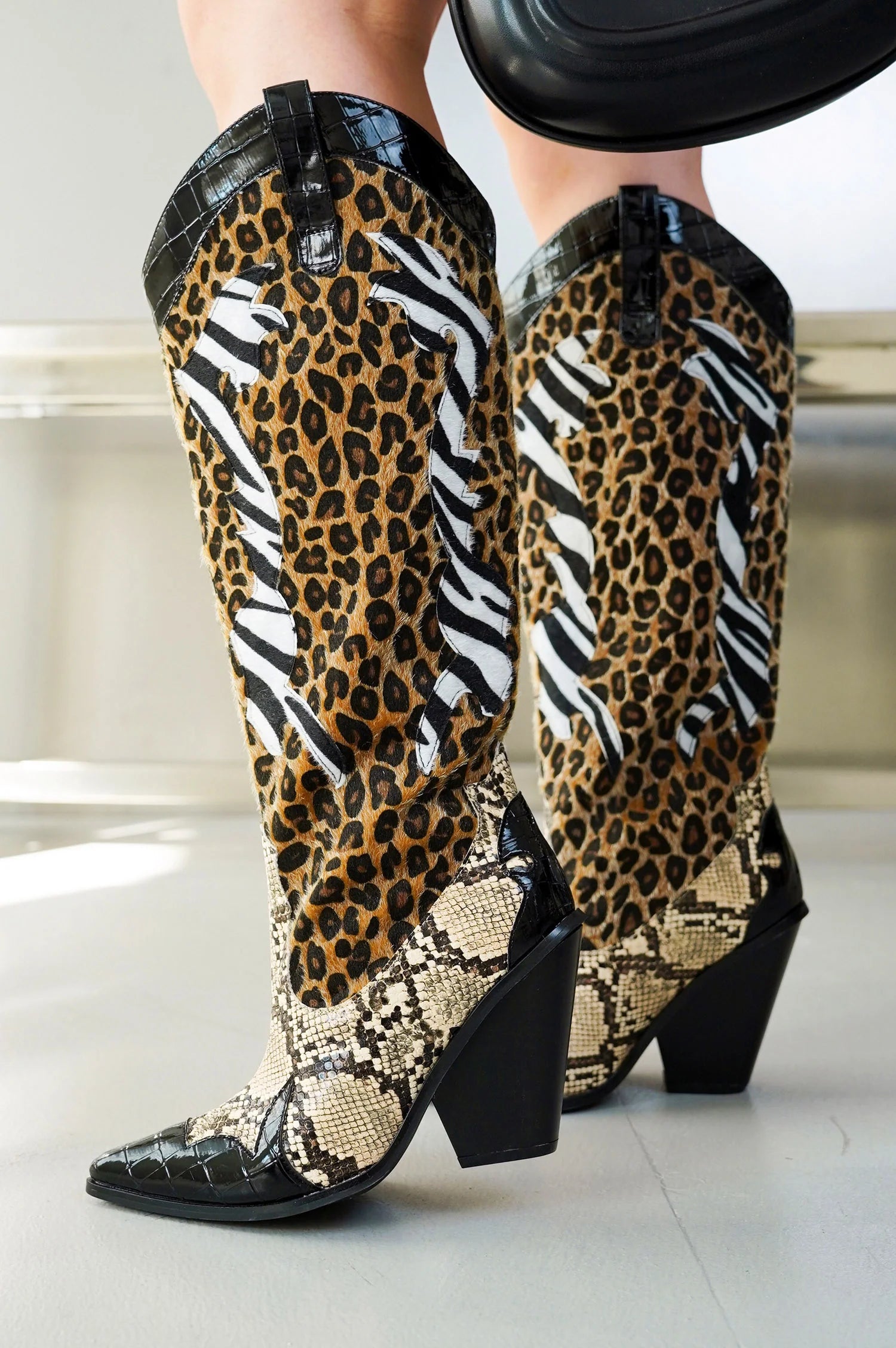 Black Brown Multi Faux Leopard Snake Zebra Cowboy Boot
- Knee High Colorblock Cowboy Boot
- Pointy Toe
- Cone Stacked Heel, Approx. 3"