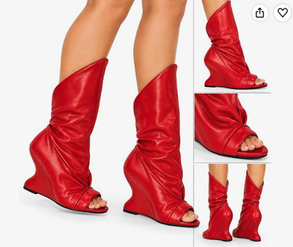 PACO-3 RED FAUX LEATHER  PEEP TOE BOOT WITH ASSYMETRICAL SHAFT AND SCULPTED CUT OUT WEDGE HEEL